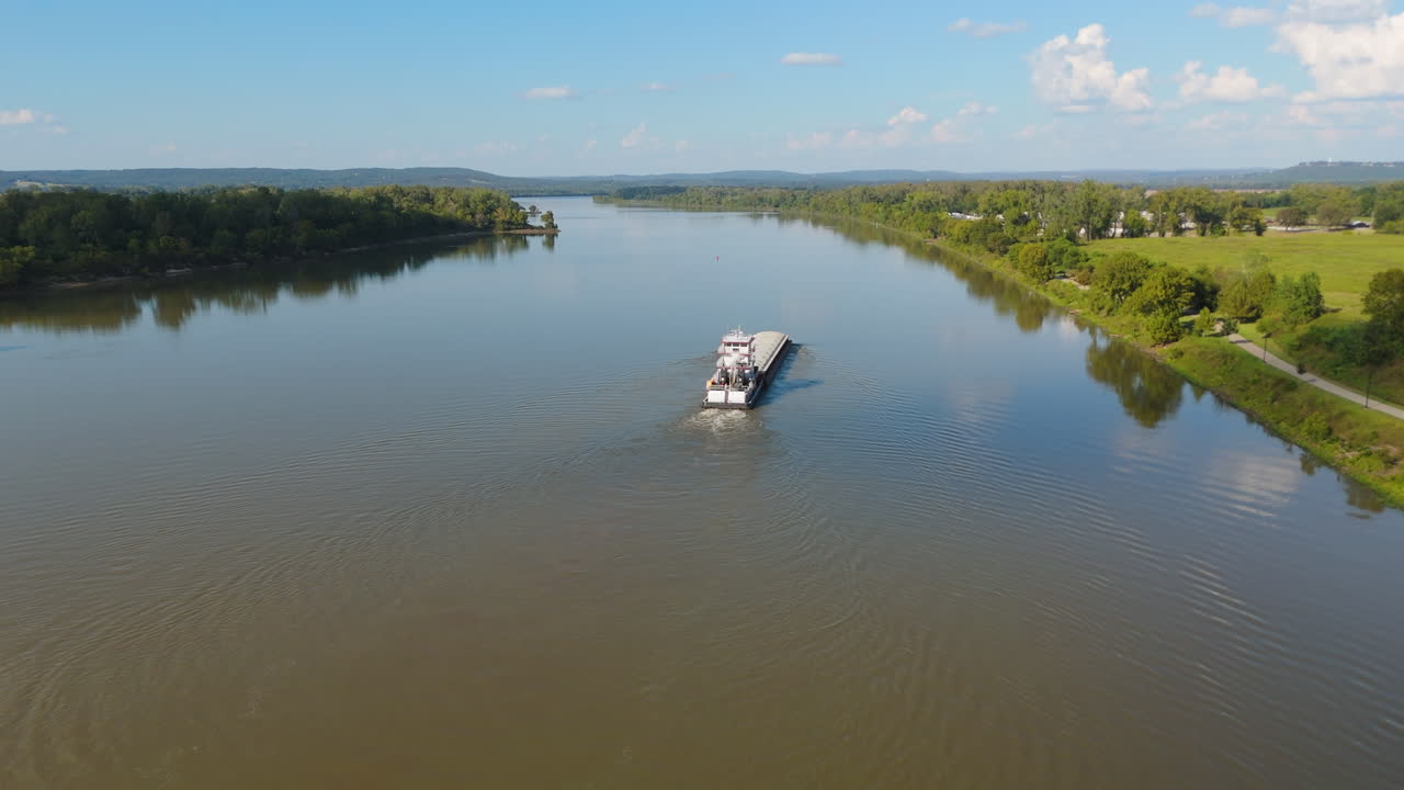 Barge Travelling Along Arkansas River In Fort Smith, Arkansas. aerial pullback shot