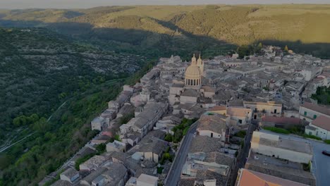 flight around ragusa ibla city center during sunset with the beautiful hills landscape in the background
