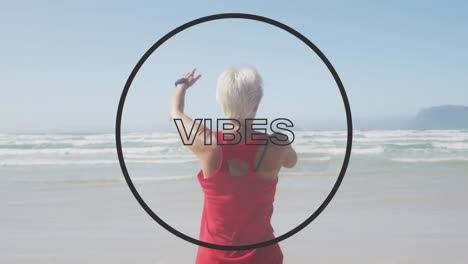 animation of text vibes, in black outline, with circle, over woman stretching on beach by sea