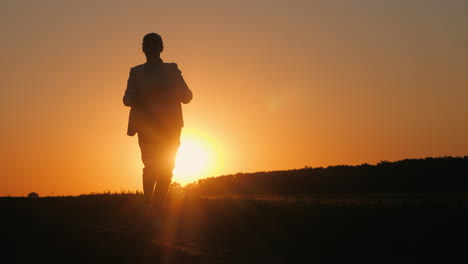 woman walking at sunset