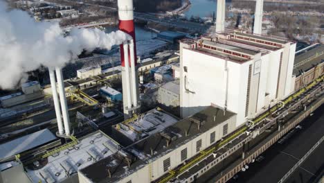 steam coming out of the pipes of thermal power plant in warsaw