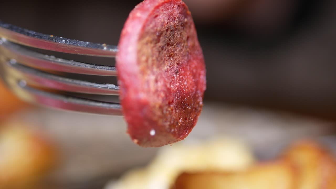 Fried Sausage Slice on a Fork