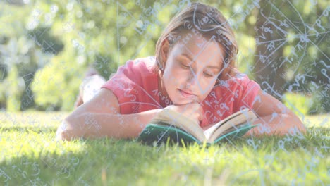 composición digital de ecuaciones matemáticas flotando contra una chica leyendo un libro mientras está acostada en el