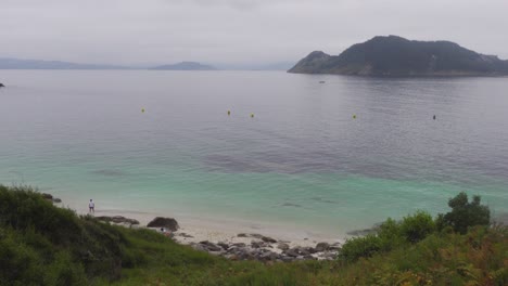 A-Paradisiacal-and-Mysterious-Looking-Beach-with-Turquoise-Water-on-Cies-Islands,-Spain