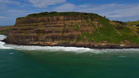 Beautiful-waves-at-Lennox-Head-Mountain-in-Australia--aerial