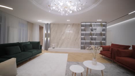 sophisticated living room illuminated by a unique ceiling light fixture, with elegant beige and green sofas setting a serene, upscale ambiance