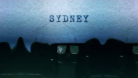 sydney word closeup being typing and centered on a sheet of paper on old vintage typewriter