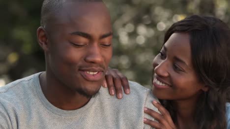 Happy-young-couple-embracing-together