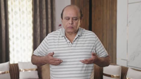 Fat-Indian-man-doing-yoga-and-meditation