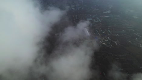 aerial view of industrial area with fog and smoke