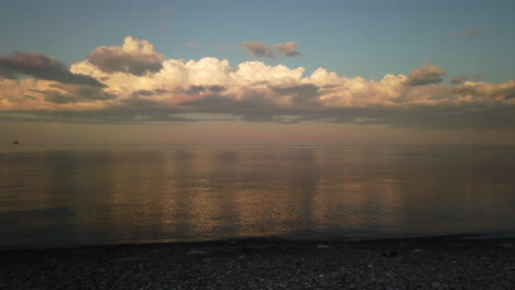 Wide-panning-shot-of-a-lake-with-beautiful-sky-reflected-on-water