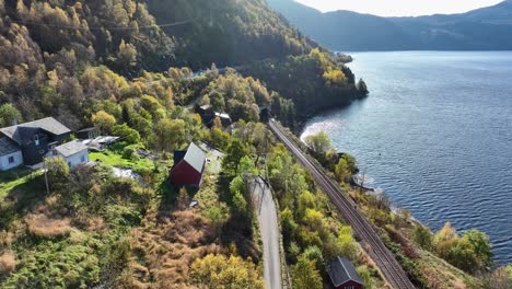 bergensbanen railway at skreien in beautiful autumn sun, aerial norway