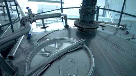 innovative machinery on a dairy farm. modern equipment on a milk factory. metal containers for processing milk products.