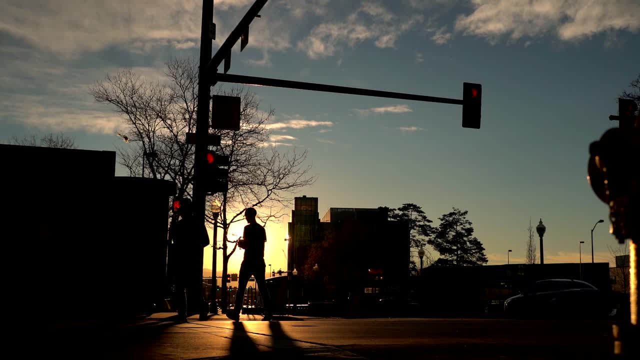Pedestrians crossing a street in slow motion