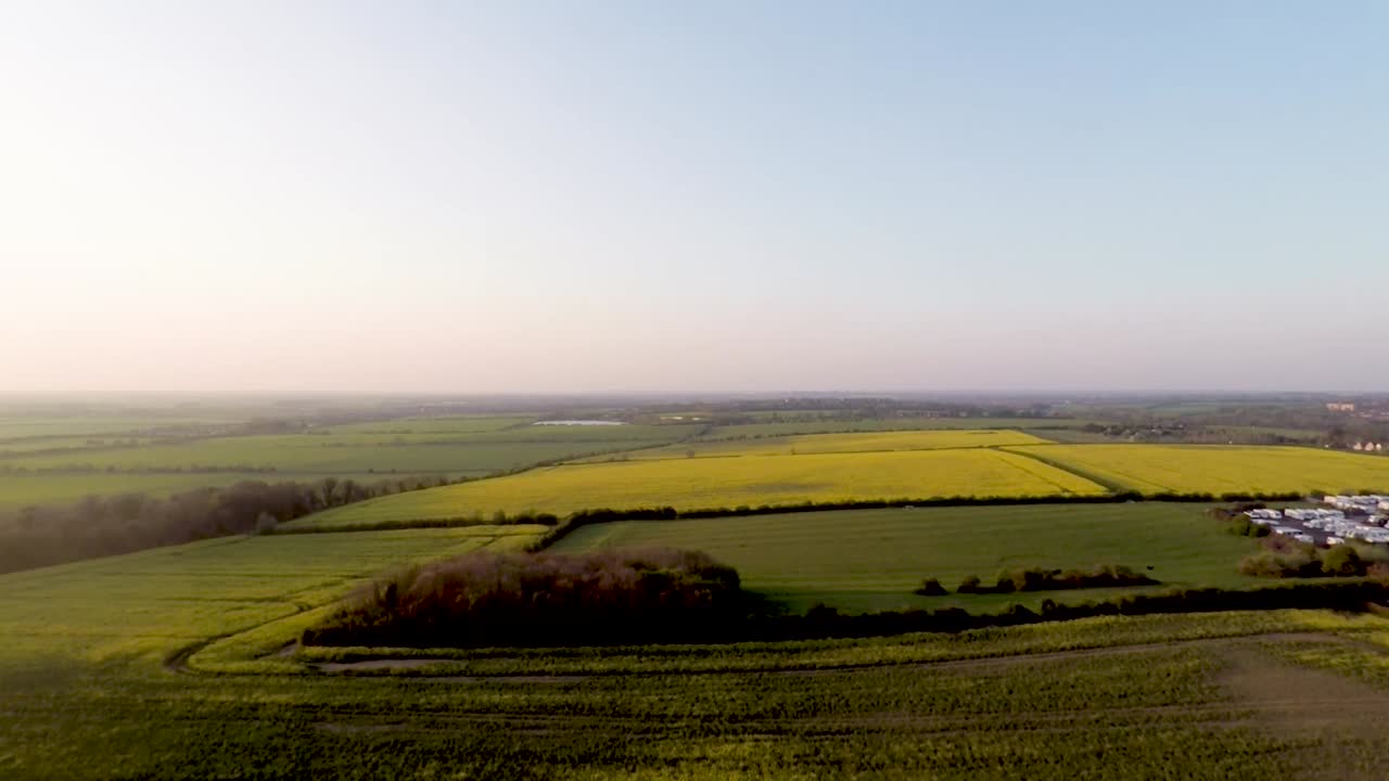 Flying over beautiful yellow fields as the sun slowly sets-7