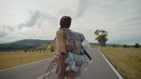 woman enjoying while walking on road