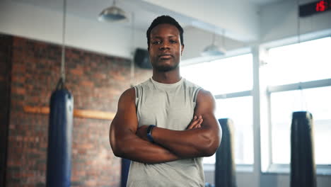 gym, arms crossed and black man serious