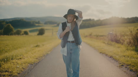 thoughtful woman walking on footpath near meadow