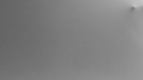 a creepy silhouette of a woman's face appears screaming from the white surface