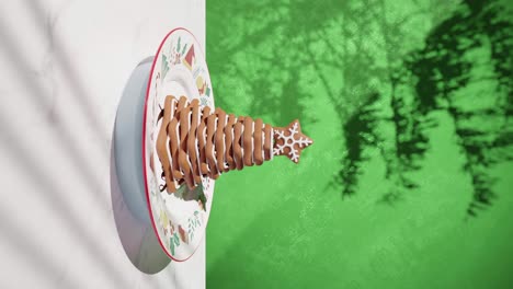 chocolate-cookie-pyramid-cake-with-green-nature-background-on-a-table-with-white-tablecloth