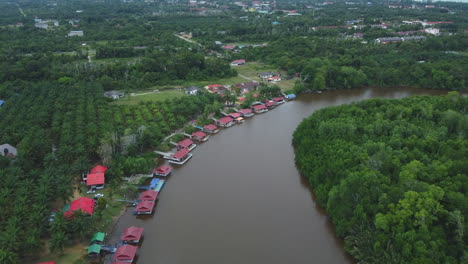 Drone-view-of-meandering-river-and-villas-in-Rompin-Pahang,-Malaysia