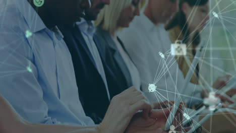 animation of data processing over diverse business people at meeting