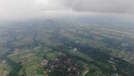 heavy fog over landscape of indonesia, high altitude drone view