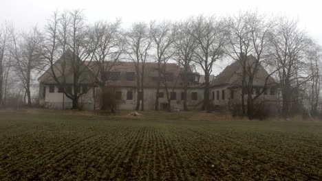 Abandoned-And-Destroyed-Old-Farmhouse-Against-Misty-Sky-In-Ukraine