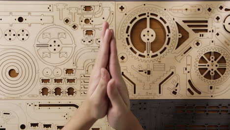 rubbing hands and getting ready to assemble a diy game puzzle