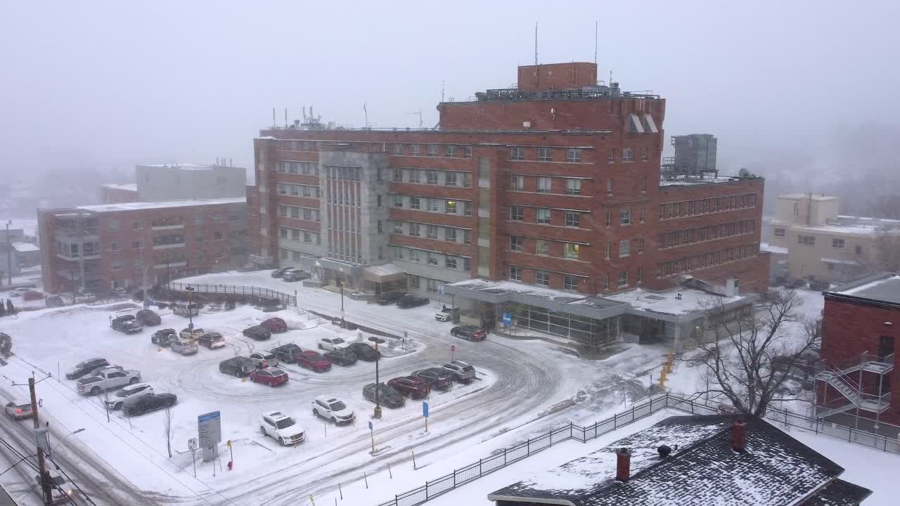 Snowy city covered in thick fog in Orford, Quebec, Canada