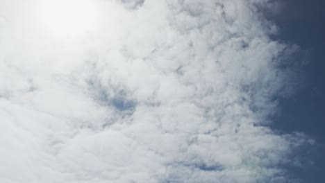 low angle of blue sky with sunshine and clouds