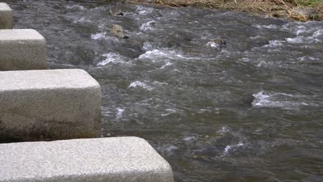 Stream-Flowing-Fast-Over-Rocks-In-Yangjaecheon,-Seoul,-South-Korea---high-angle,-close-up