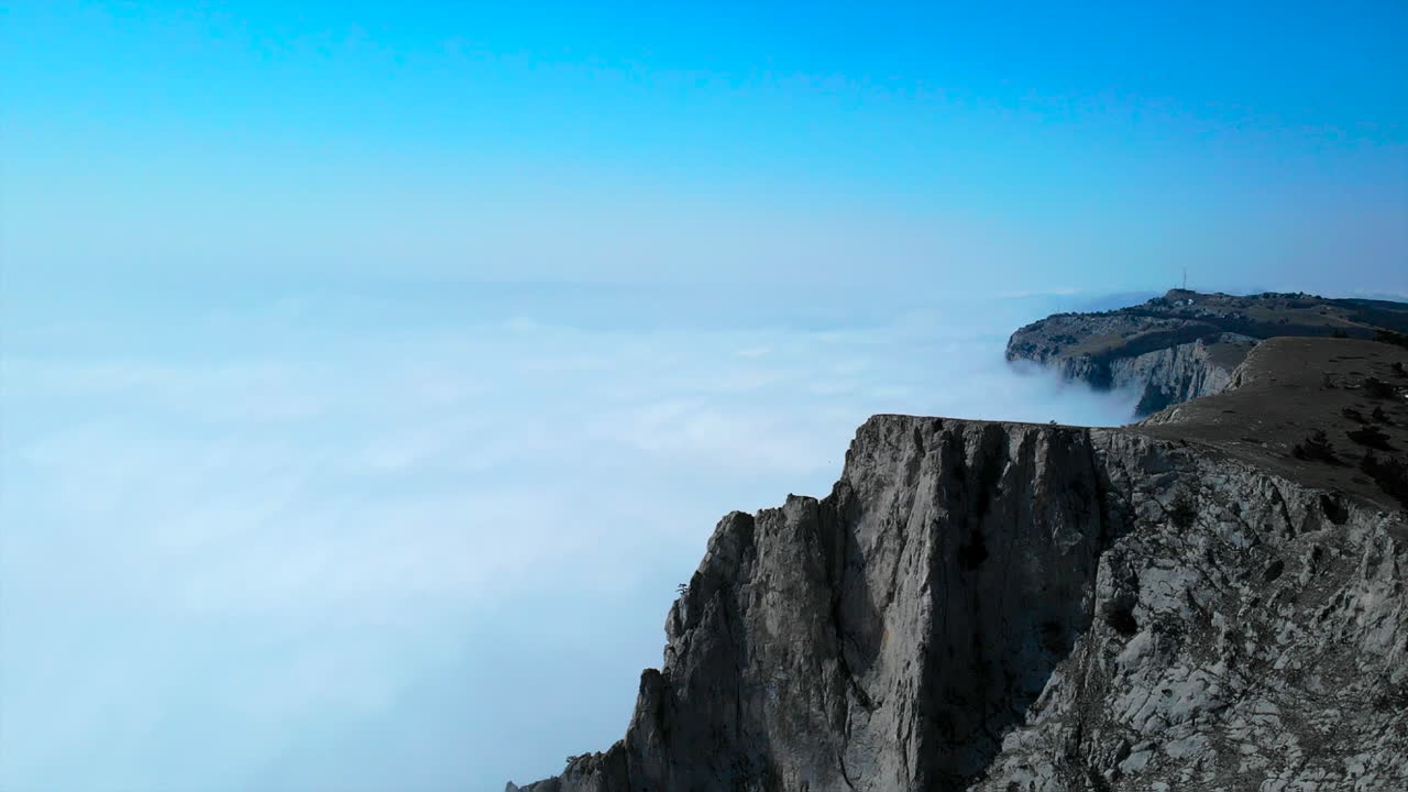 Mountain Cliff Above the Clouds