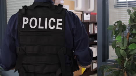 police walking through a precinct