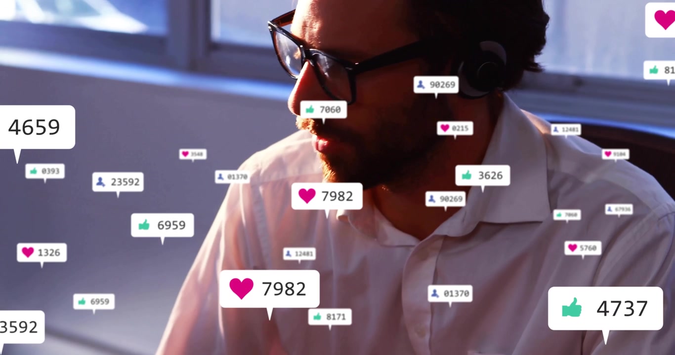 Man raising hand speaking into headset, activating floating icons tracking social media engagement