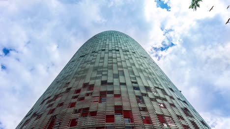 modern skyscraper building with moving clouds loop