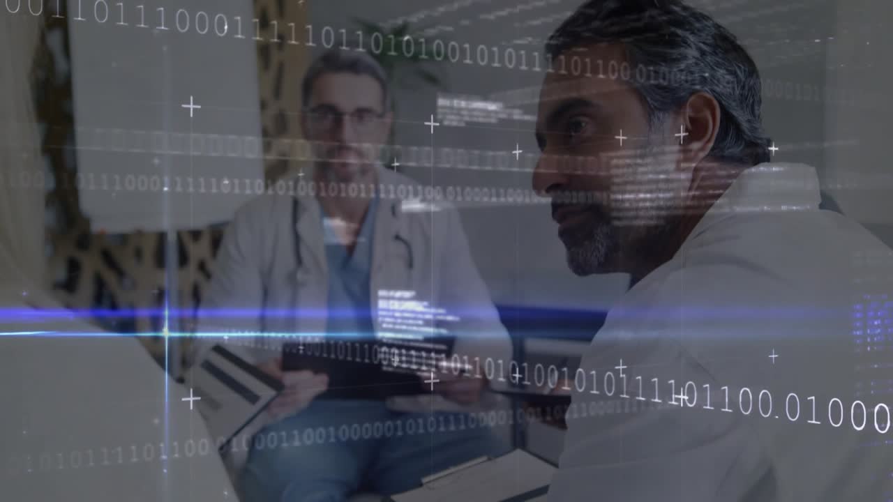 Male doctor tapping tablet initiating binary code overlay and colleague reviewing patient data