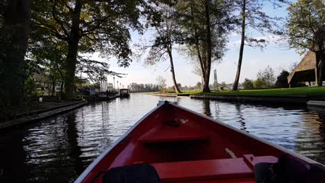 Slow-motion-footage-of-onboard-the-small-boat-crossing-the-canal-or-river