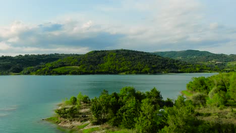 aerial establishing shot revealing island outcropping of lake butoniga croatia in summer