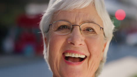 face portrait of a laughing older woman looking