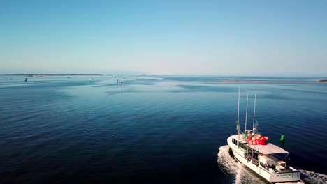 Fishing-Boat-Departs,-Hatteras-North-Carolina,-Hatteras-NC,-The-Outer-Banks