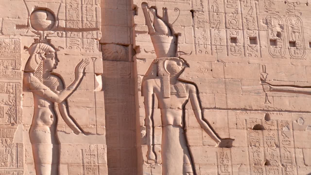 Details of ancient hieroglyphs on a wall in an ancient temple Philae in Aswan, Egypt.
