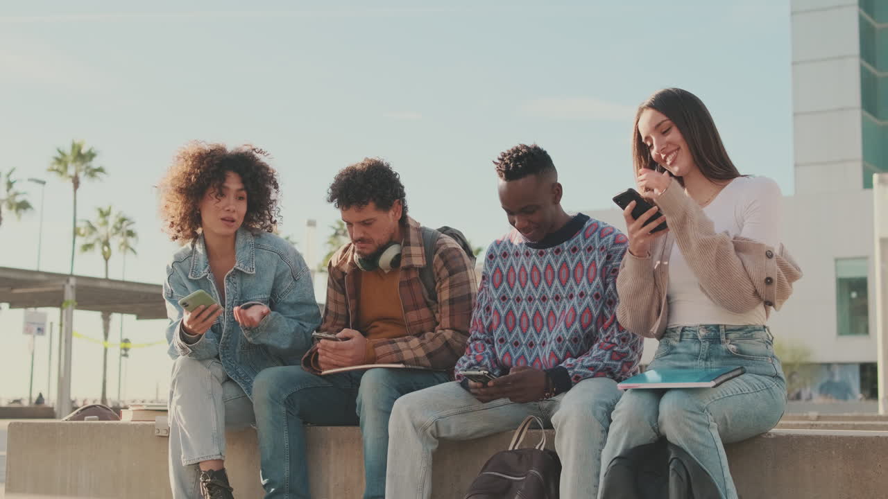 Group of friends using smartphones