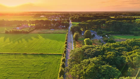 amazing nature landscapes with some private houses in the village. spectacular scenery of rural area at sunset from drone