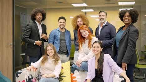 multi-ethnic team of coworkers smiling at camera together