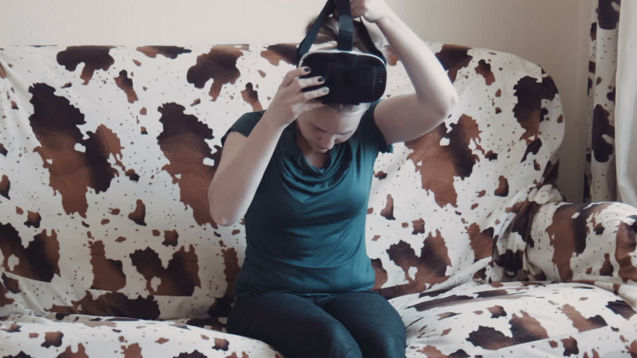 Woman Experiencing Virtual Reality on a Couch