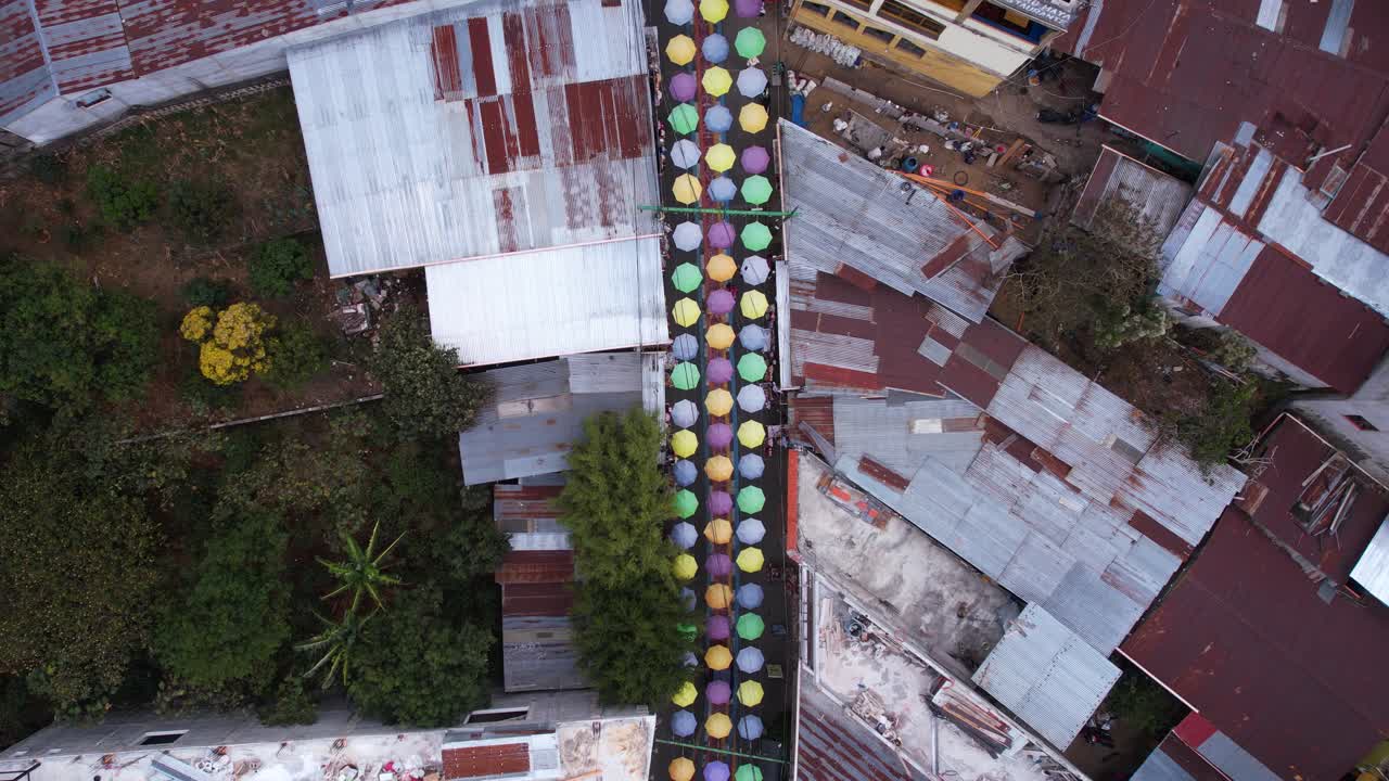 Birdseye Aerial View of Colorful Umbrella Street, Landmark of San Juan la Laguna and Lake Atitlan, Guatemala