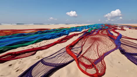 colorful textile installation on a beach