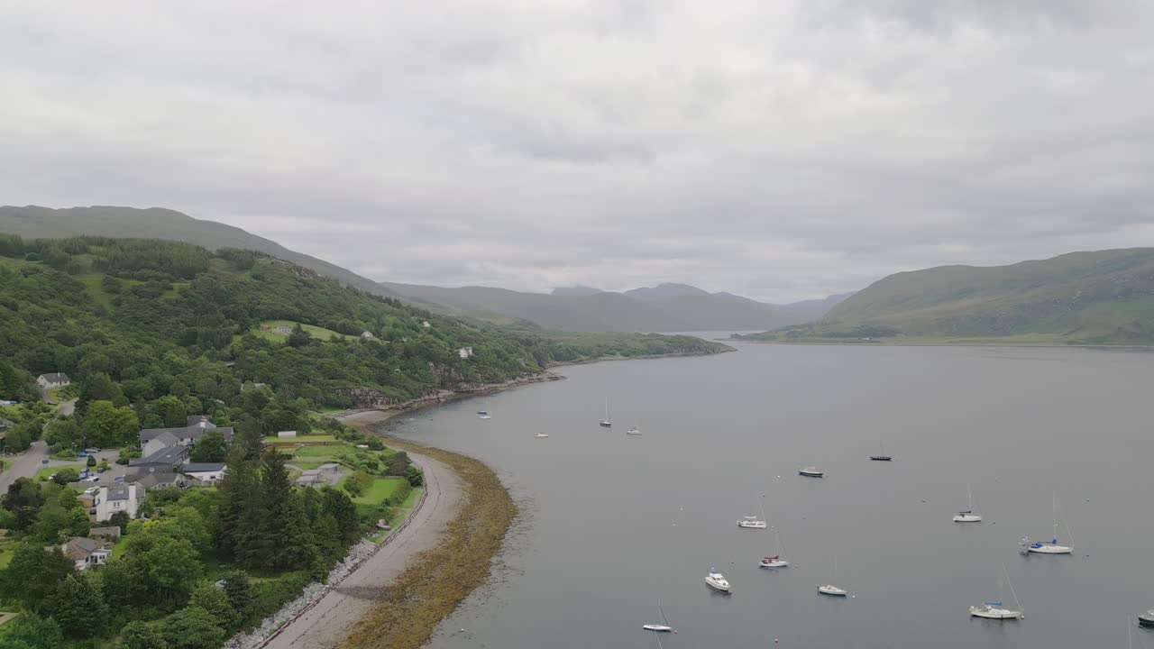 Coastal landscape with mountains and boats