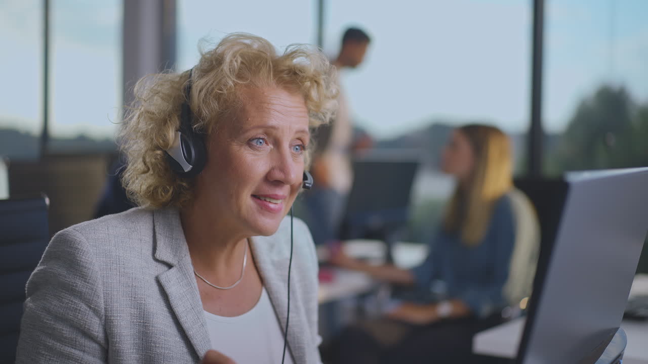 Businesswoman using headset in the call center